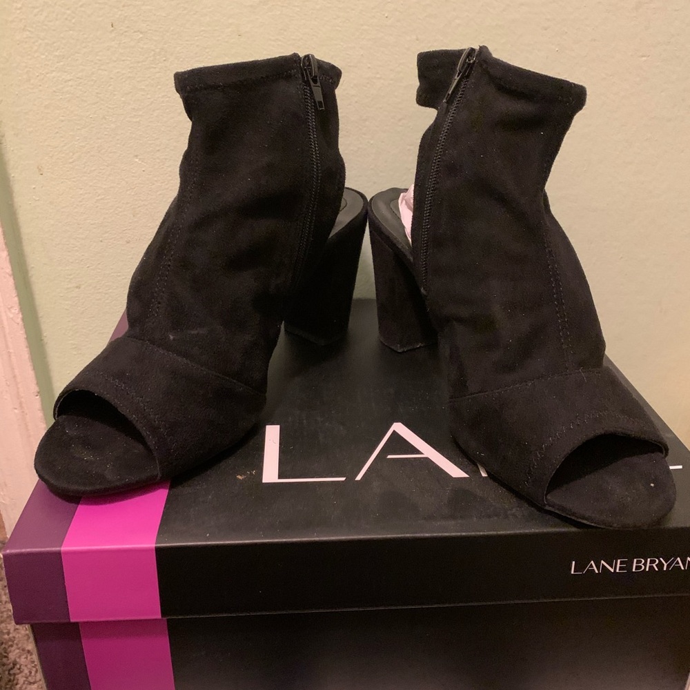 Gently used zipper, open toe, exposed heel bootie